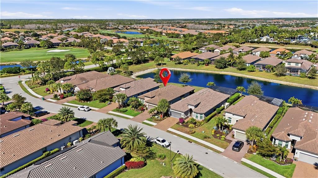 8665 Dilillo Court Naples, FL 34119 - Photo 2 of 42 an aerial view of residential houses with outdoor space
