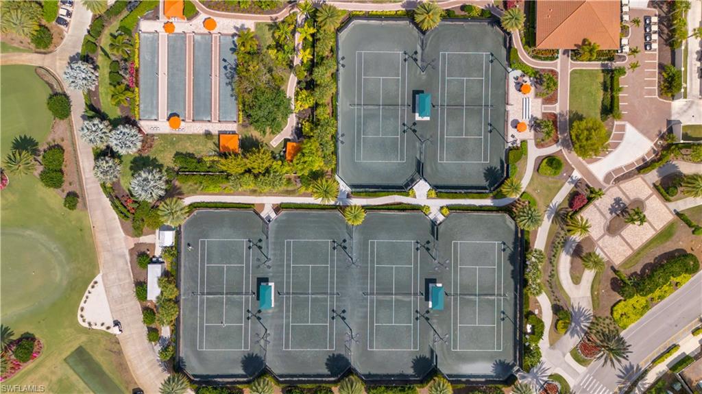 8665 Dilillo Court Naples, FL 34119 - Photo 34 of 42 aerial view of a residential apartment building with a yard
