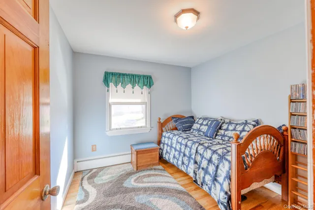 a bedroom with furniture and a window