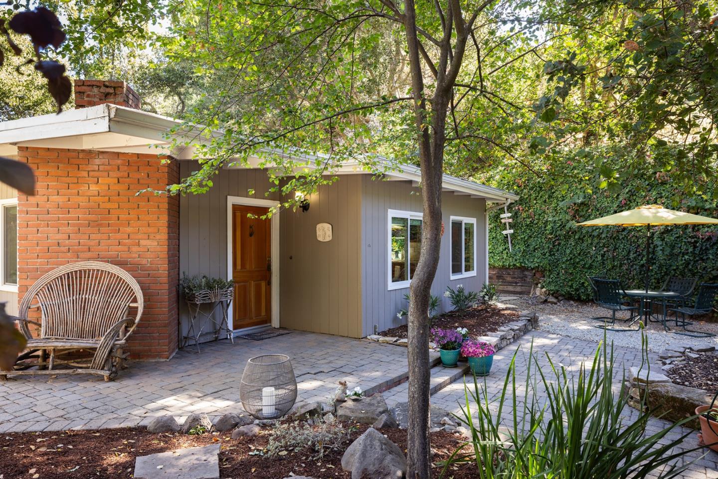 32 Southbank Road Carmel Valley, CA 93924 - Photo 1 of 21 a front view of a house with garden