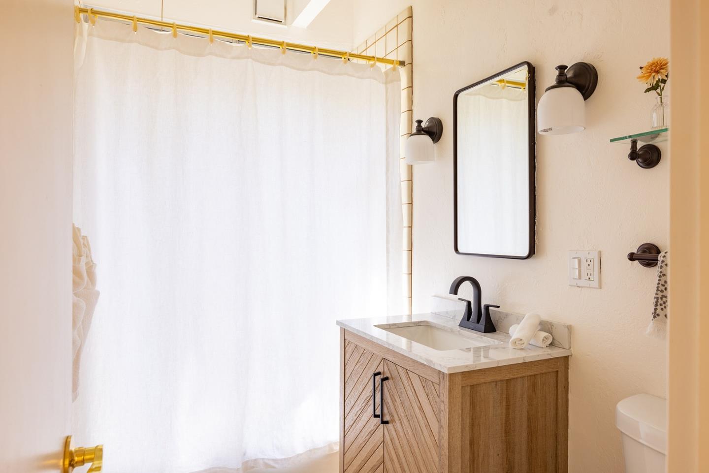 32 Southbank Road Carmel Valley, CA 93924 - Photo 13 of 21 a bathroom with a sink and a mirror