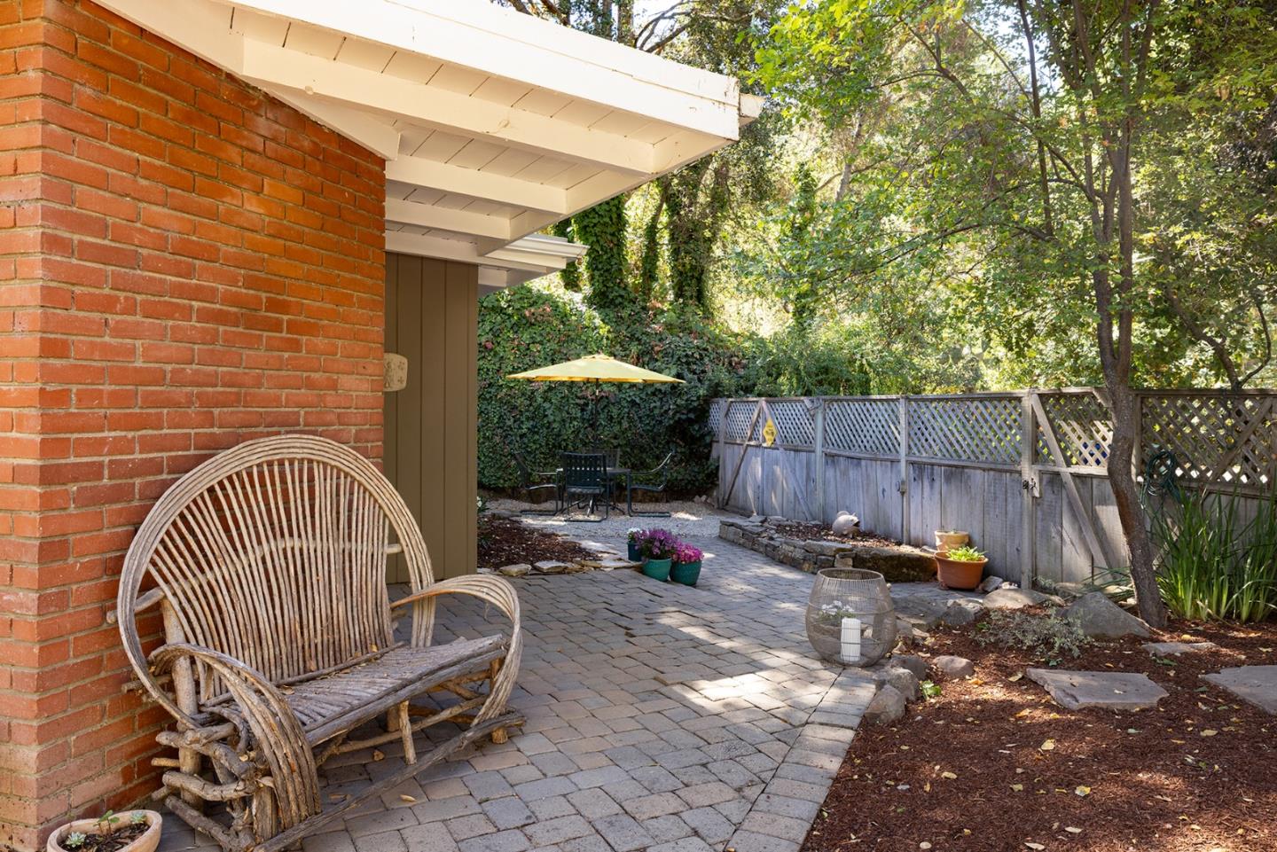 32 Southbank Road Carmel Valley, CA 93924 - Photo 18 of 21 a view of backyard with a table and chairs