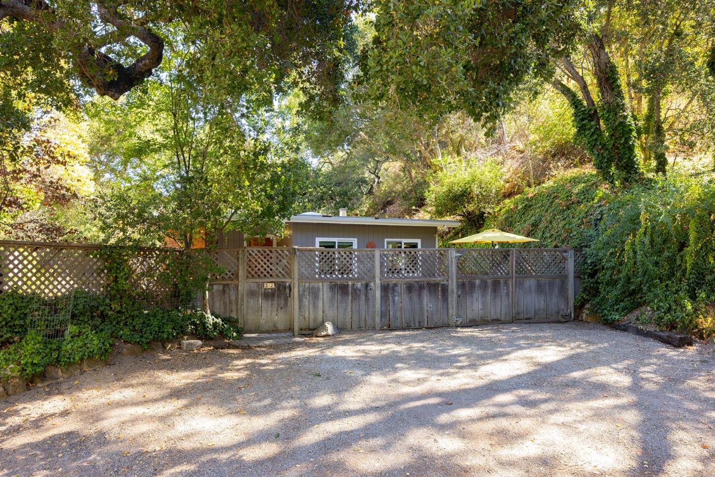 32 Southbank Road Carmel Valley, CA 93924 - Photo 21 of 21 a front view of a house with a yard and garage