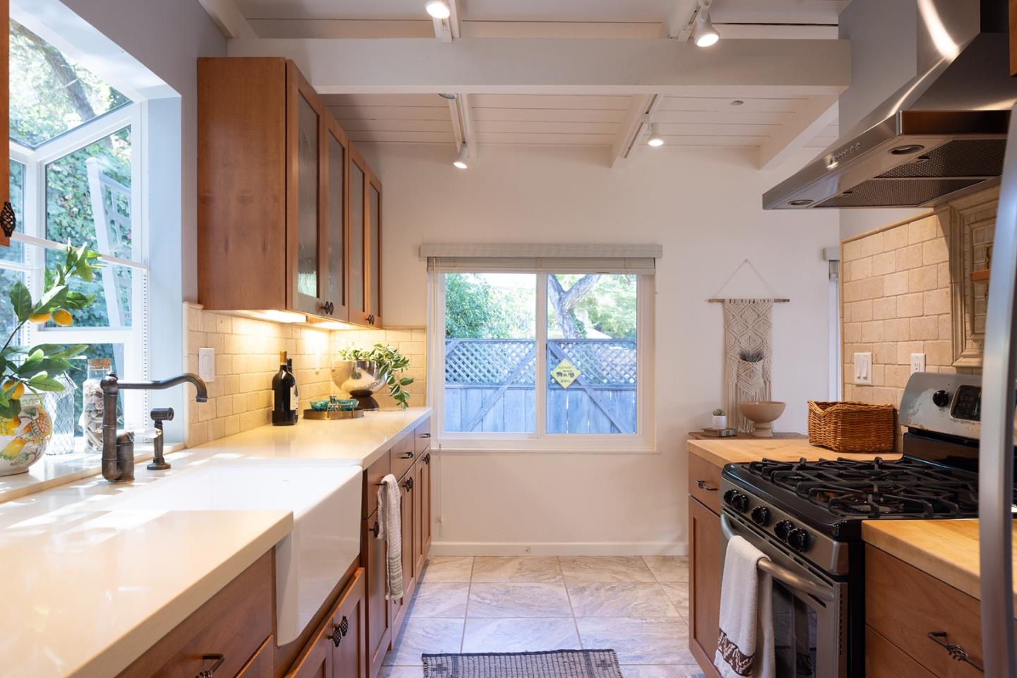 32 Southbank Road Carmel Valley, CA 93924 - Photo 7 of 21 a kitchen with a stove a sink and a refrigerator