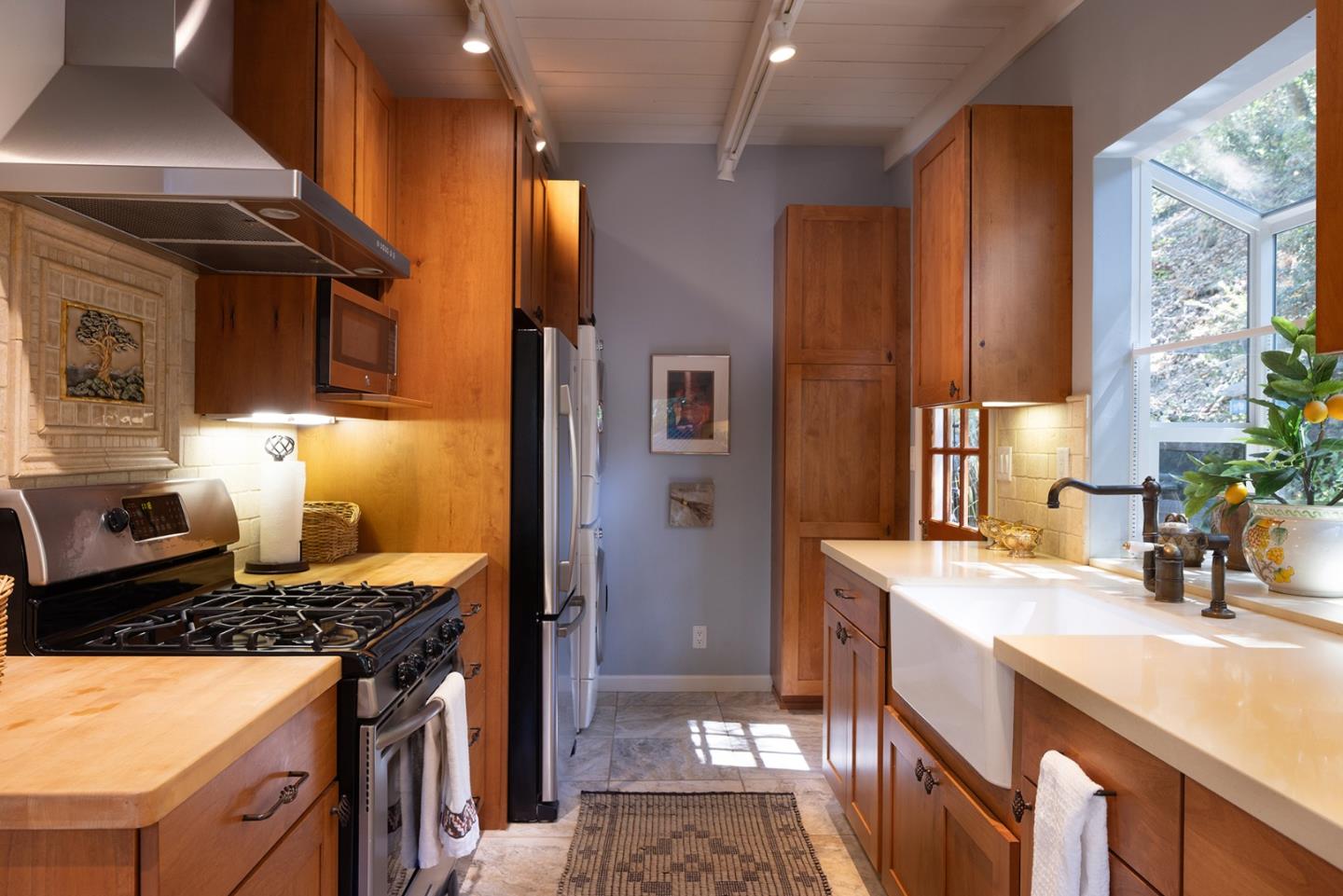 32 Southbank Road Carmel Valley, CA 93924 - Photo 8 of 21 a kitchen with stainless steel appliances granite countertop a sink stove and refrigerator