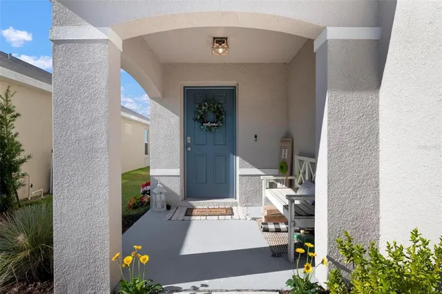 an aerial view of a house with outdoor space