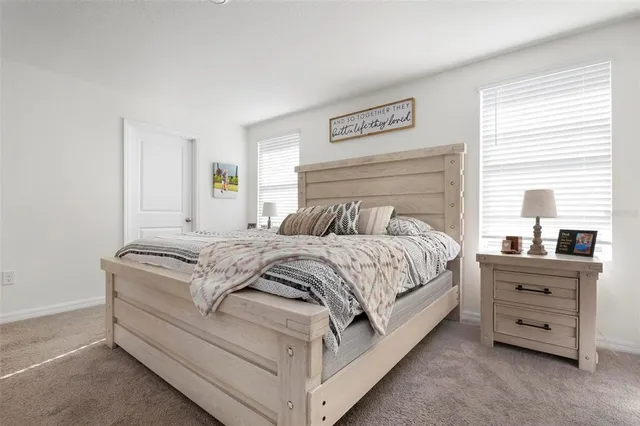a bedroom with a bed and a dresser
