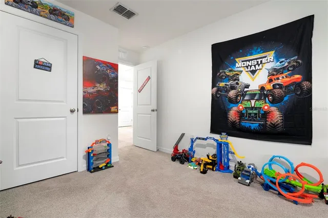 a children room with toys and a flat screen tv