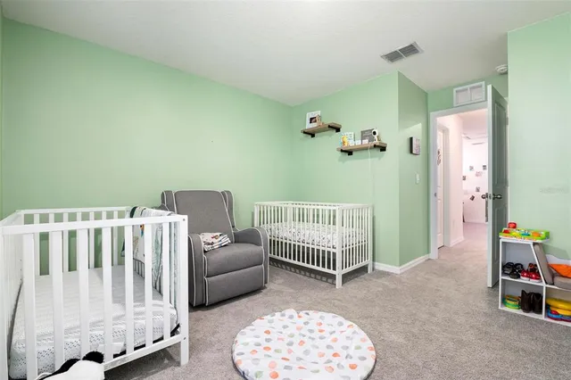 a bedroom with furniture and a window