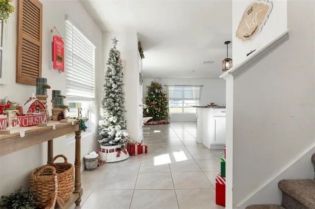 a view of a hallway with workspace and a window