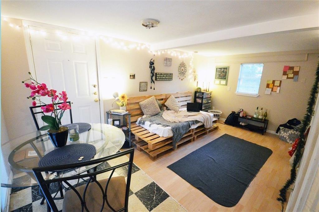 a living room with furniture and flowers