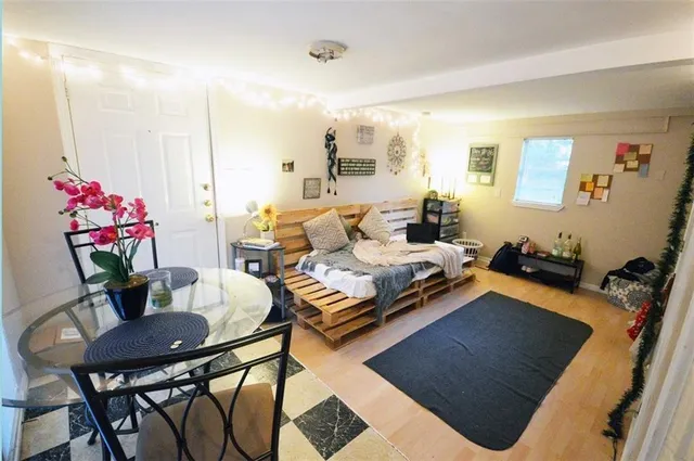 a living room with furniture and flowers