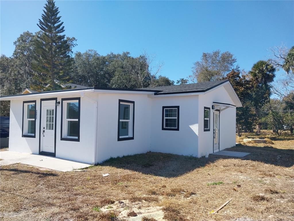 a house with trees in the background