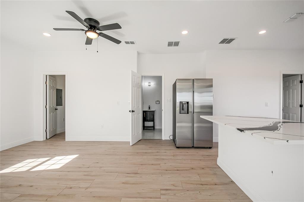 38835 Pine Street Umatilla, FL 32784 - Photo 20 of 36 a view of a kitchen with a sink and refrigerator