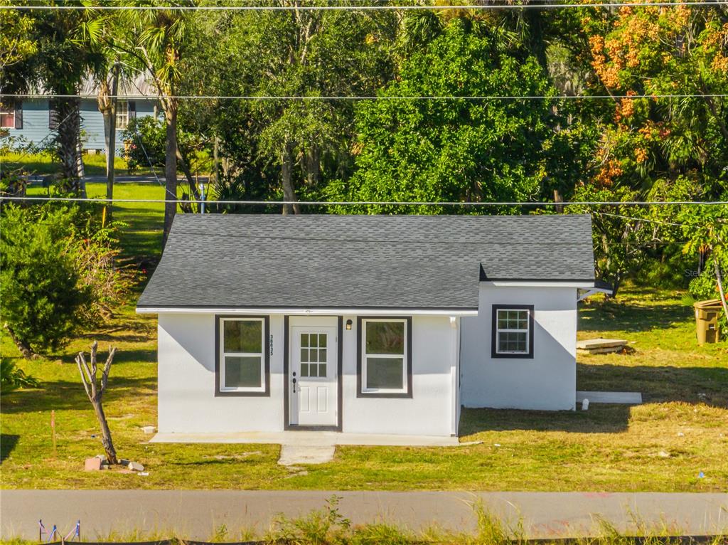 38835 Pine Street Umatilla, FL 32784 - Photo 2 of 36 a front view of a house with a yard