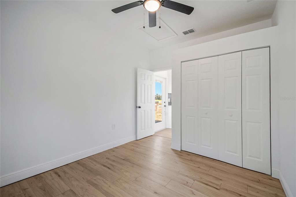 38835 Pine Street Umatilla, FL 32784 - Photo 30 of 36 wooden floor in an empty room
