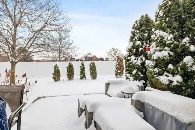 a view of a white house with many windows