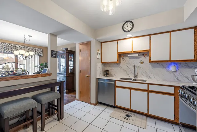 a kitchen with stainless steel appliances granite countertop a sink and cabinets