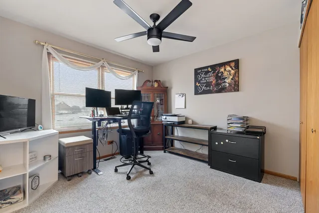 a view of a workspace with furniture