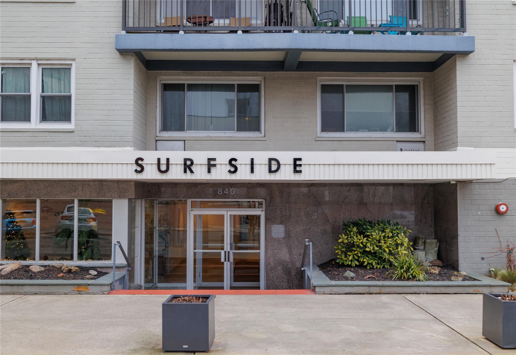 a front view of a building with outdoor space