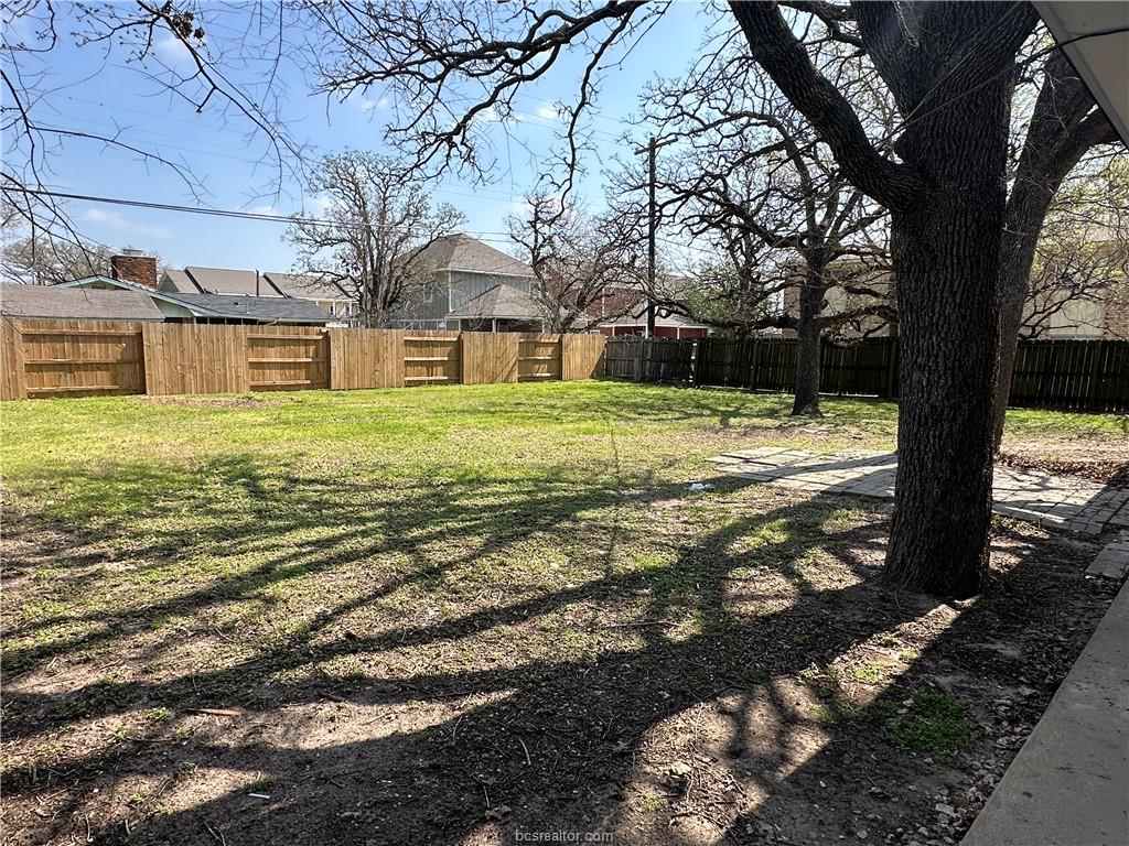 4005 College Main Street Bryan, TX 77801 - Photo 7 of 18 a big yard with some trees