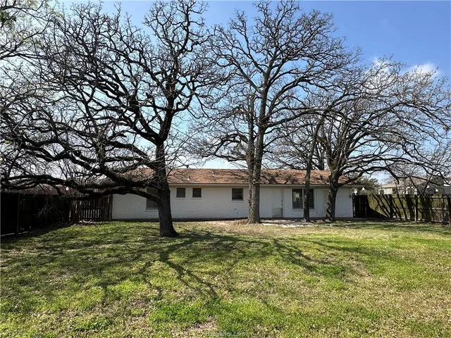 a house with trees in front of it