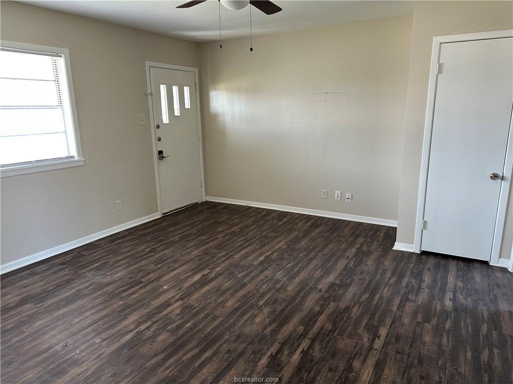 4005 College Main Street Bryan, TX 77801 - Photo 10 of 18 an empty room with wooden floor and windows