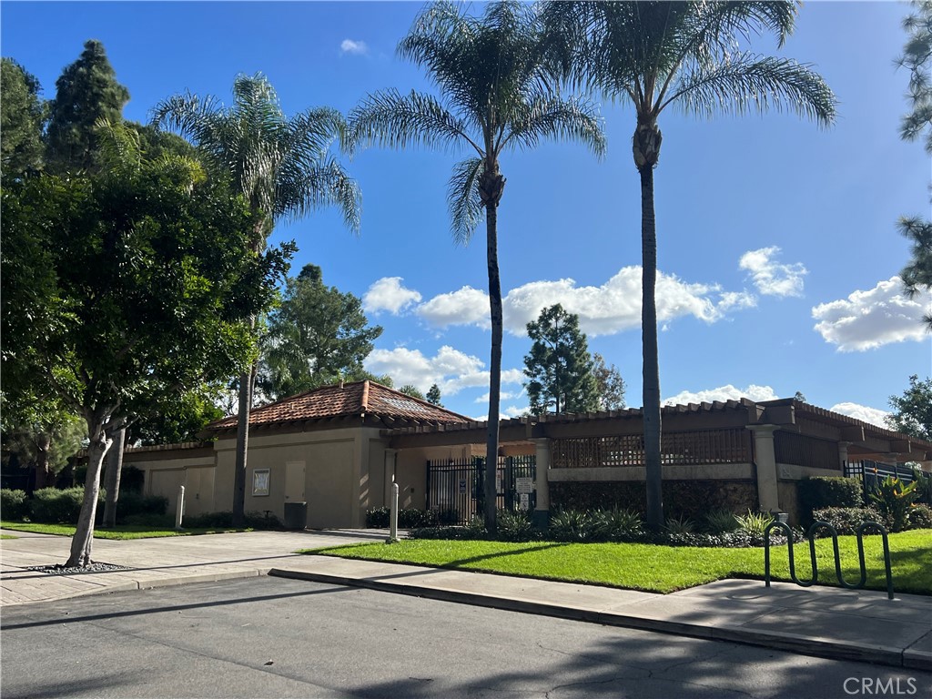 107 Gallery Tustin, CA 92782 - Photo 5 of 5 a view of a tall building next to a yard