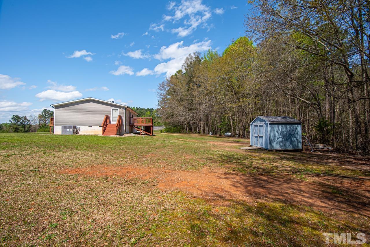 1545 Cheves Road Zebulon, NC 27597 - Photo 24 of 28 a house view with a garden space