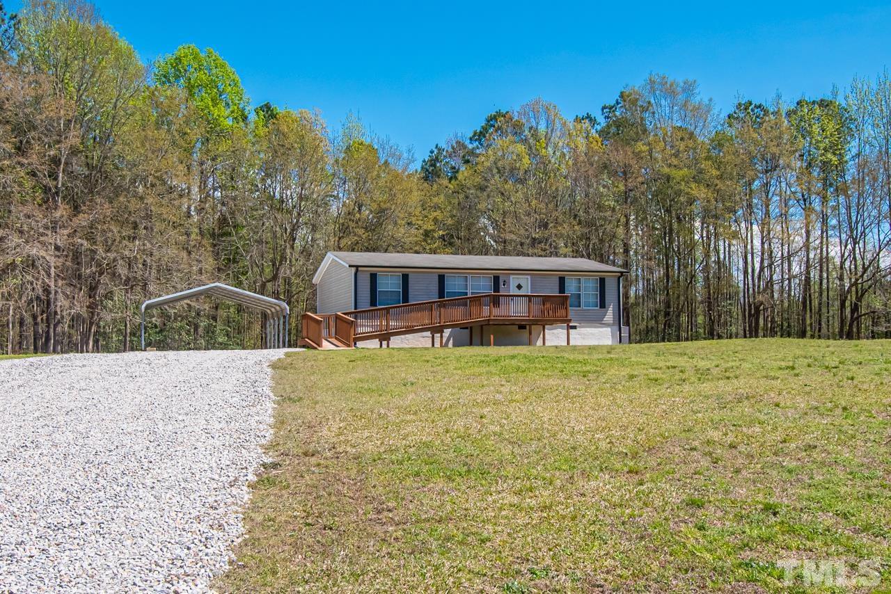 1545 Cheves Road Zebulon, NC 27597 - Photo 27 of 28 a house view with a garden space