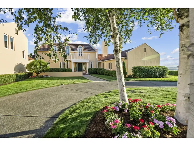a view of a house with a yard and garden