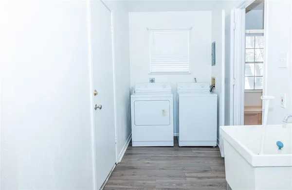 a view of a room with wooden floor and cabinet