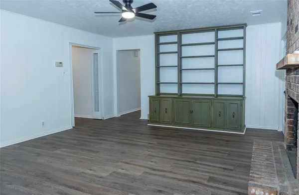 a view of a room with wooden floor and closet