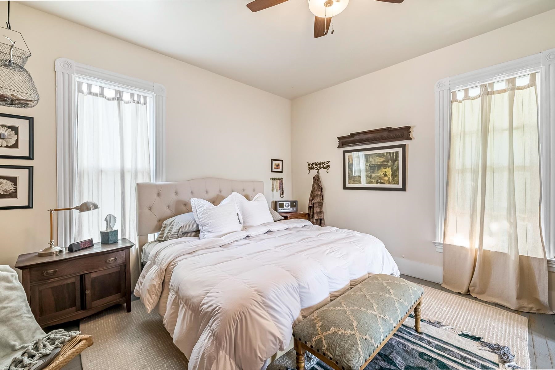 201 Front Street Loyalton, CA 96118 - Photo 20 of 28 a bedroom with a bed and wooden floor