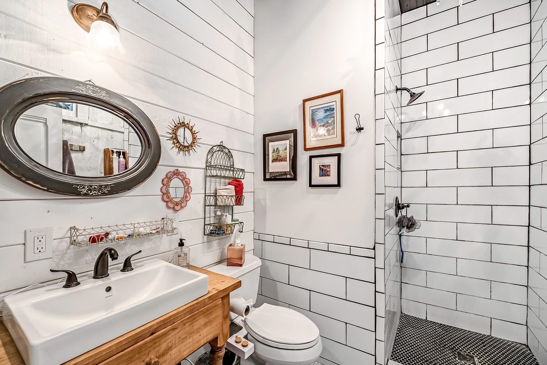 201 Front Street Loyalton, CA 96118 - Photo 23 of 28 a bathroom with a sink mirror vanity and toilet