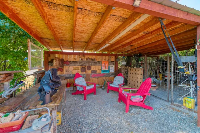 a view of garage with a table and chairs