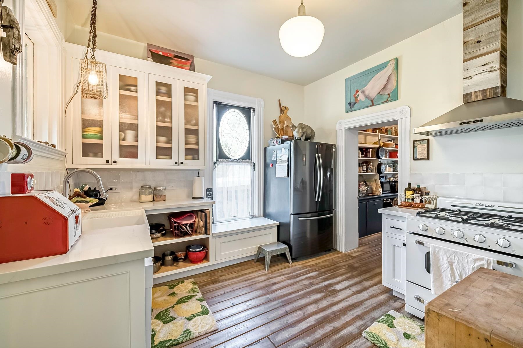 201 Front Street Loyalton, CA 96118 - Photo 10 of 28 a kitchen with stainless steel appliances a stove and a refrigerator