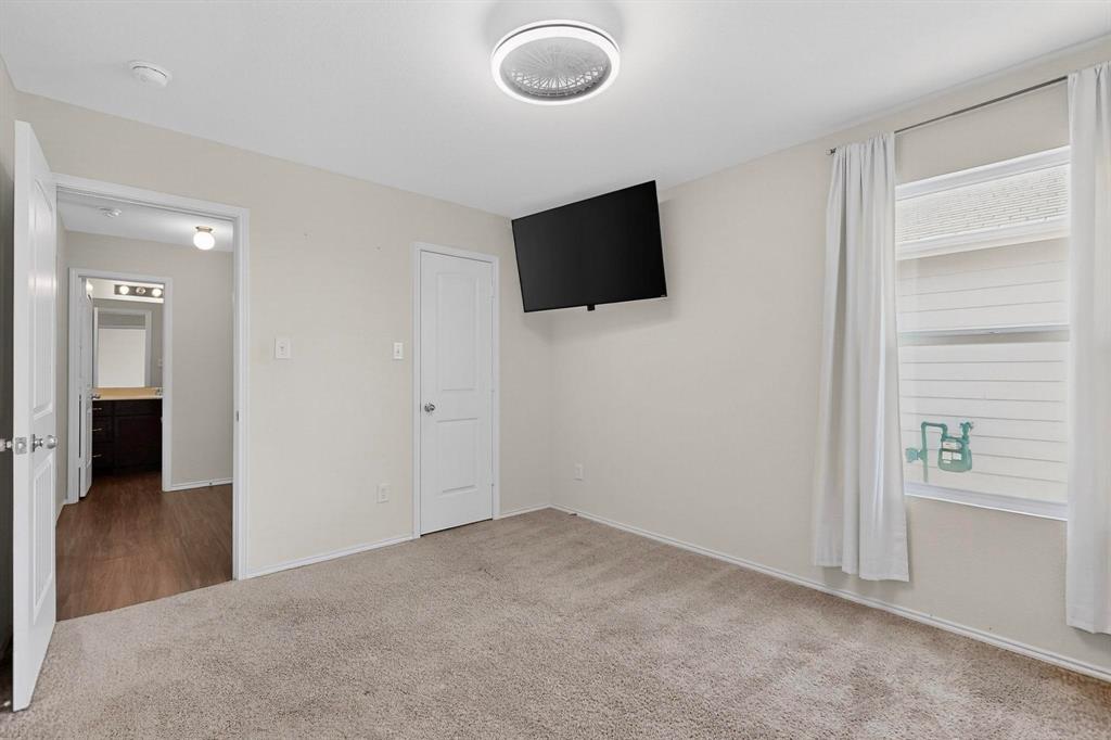 5516 McClelland Street Forney, TX 75126 - Photo 24 of 36 Unfurnished bedroom featuring carpet floors and baseboards