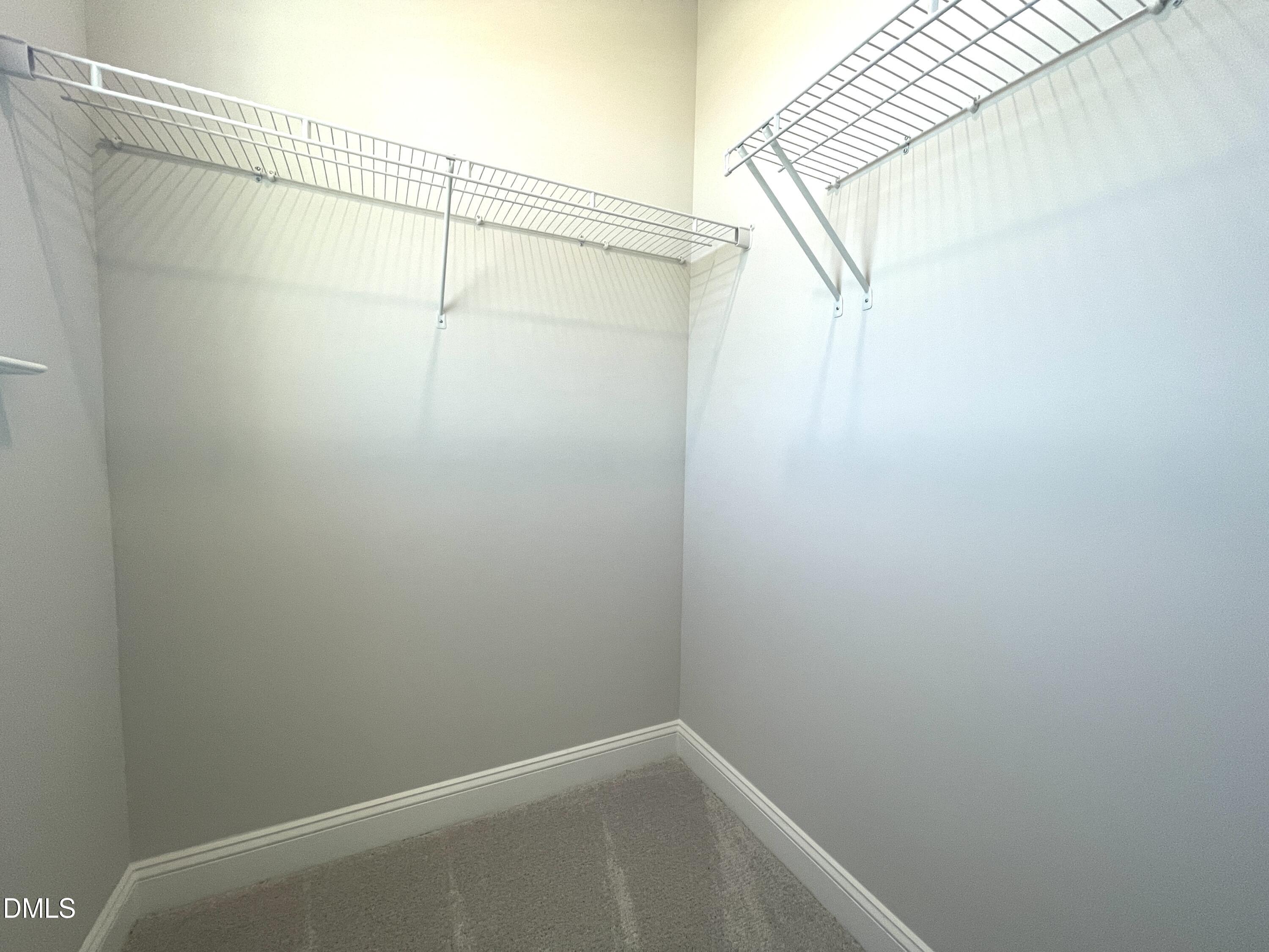 152 Baymouth Lane Raleigh, NC 27610 - Photo 17 of 34 a view of small space with racks on the wall