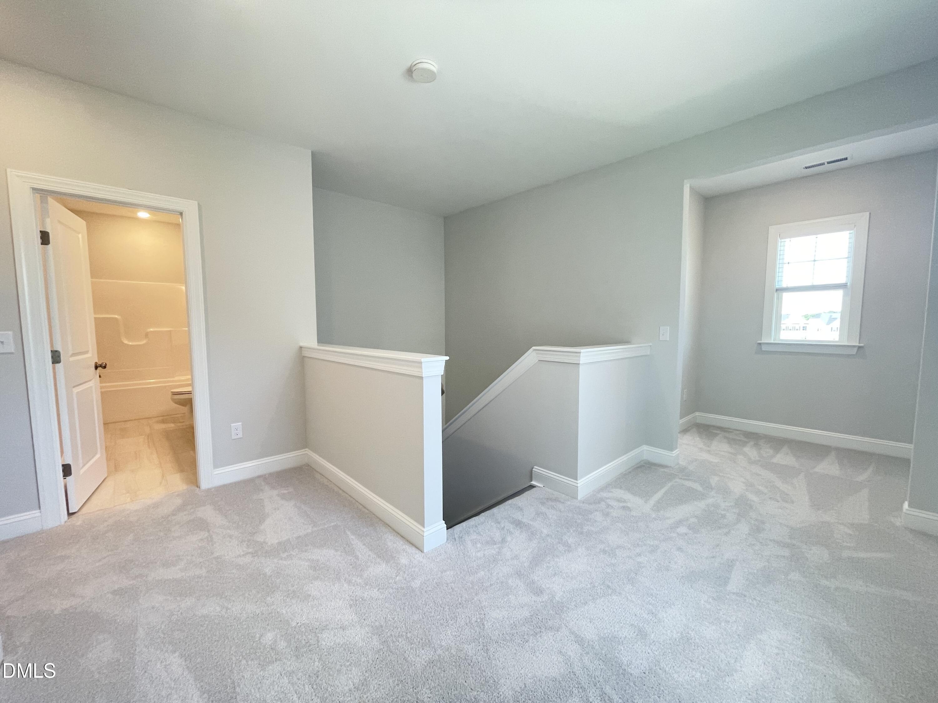152 Baymouth Lane Raleigh, NC 27610 - Photo 21 of 34 a view of an empty room and window