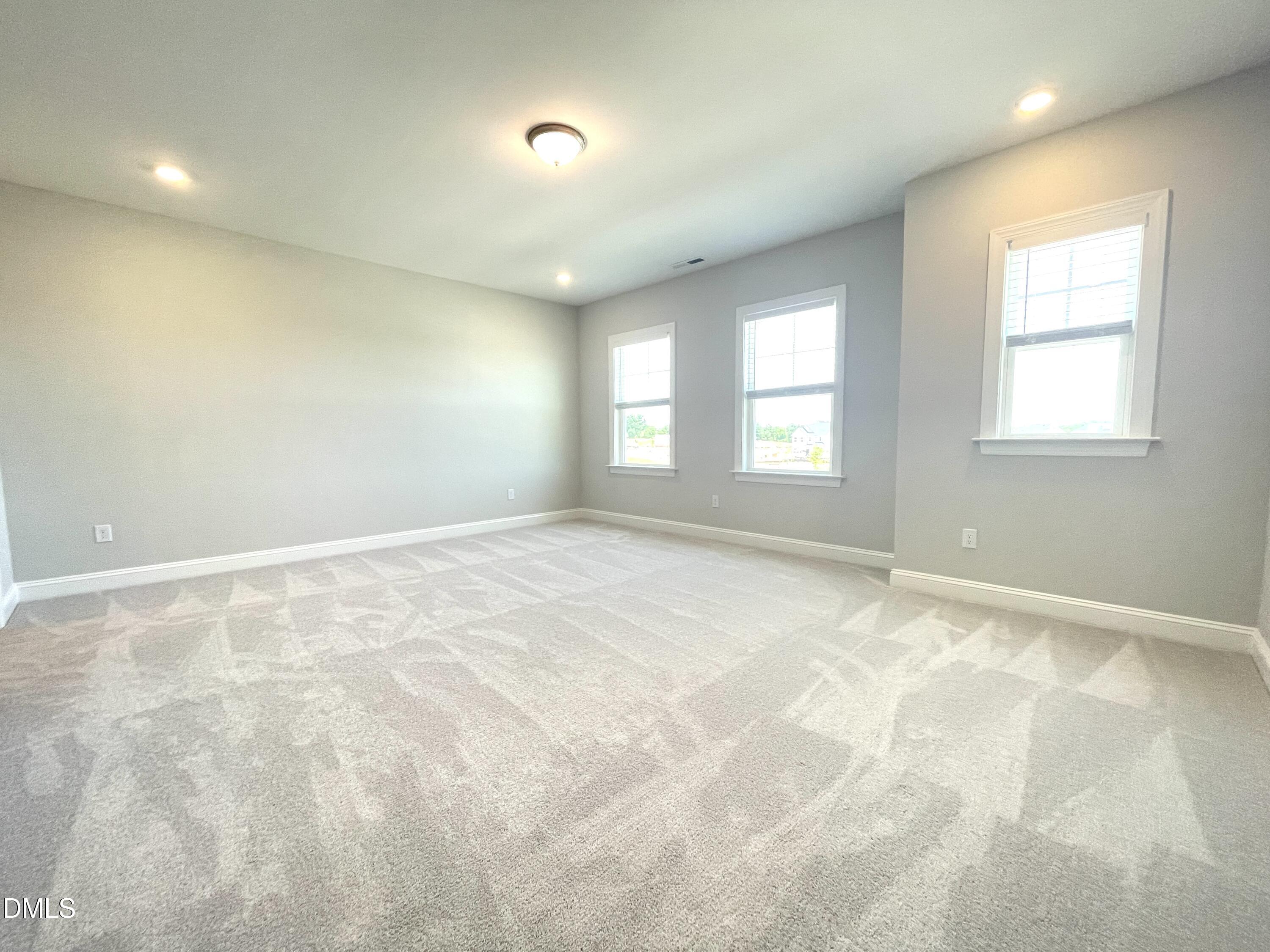 152 Baymouth Lane Raleigh, NC 27610 - Photo 22 of 34 an empty room with windows