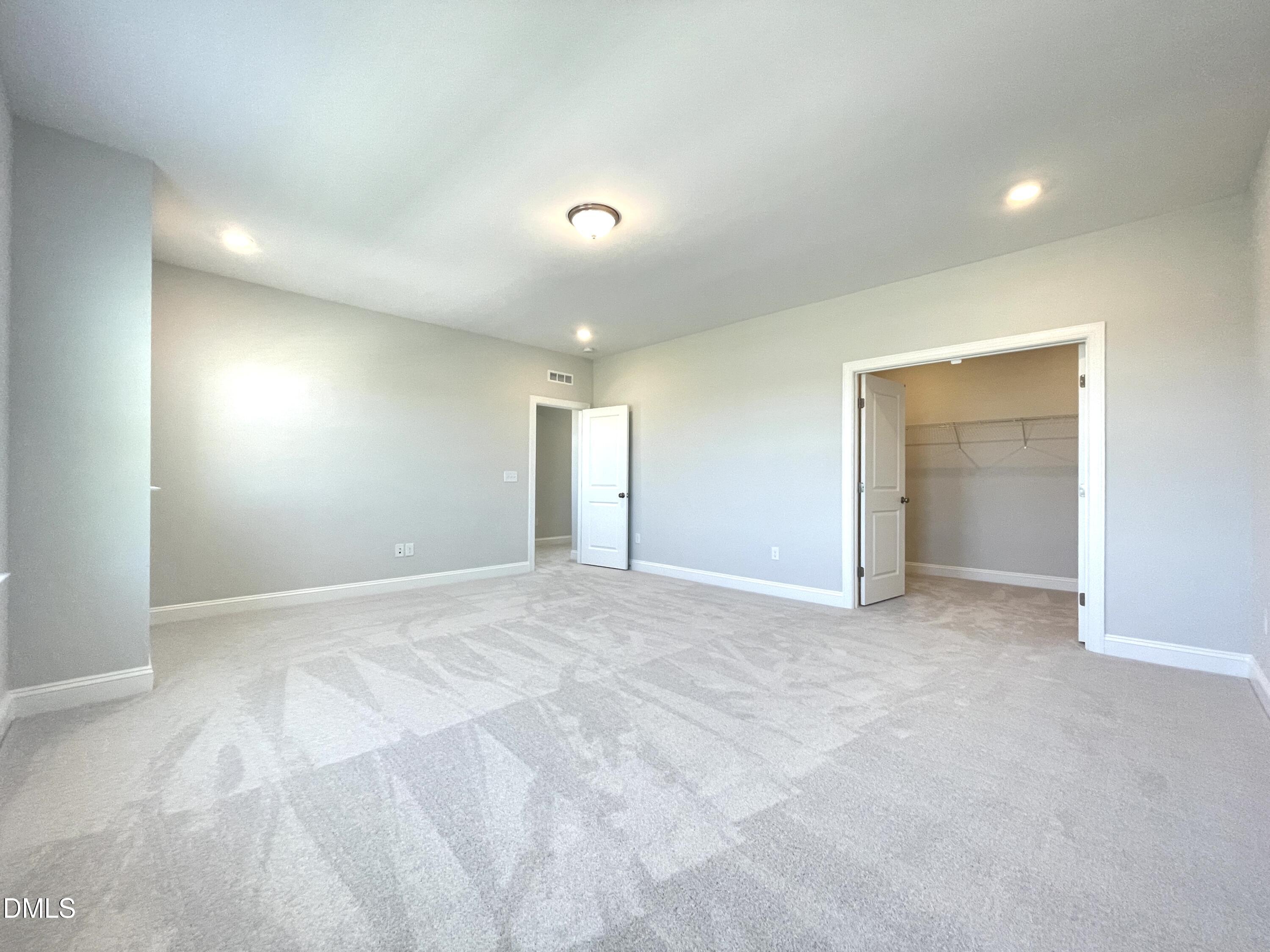 152 Baymouth Lane Raleigh, NC 27610 - Photo 23 of 34 a view of an empty room with closet and a window