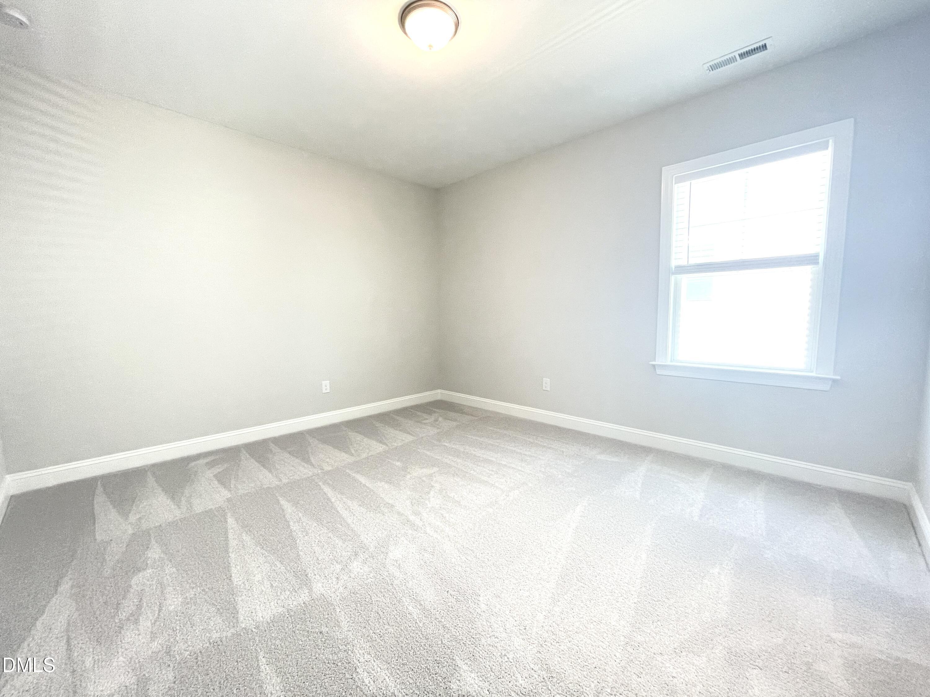 152 Baymouth Lane Raleigh, NC 27610 - Photo 24 of 34 an empty room with a window