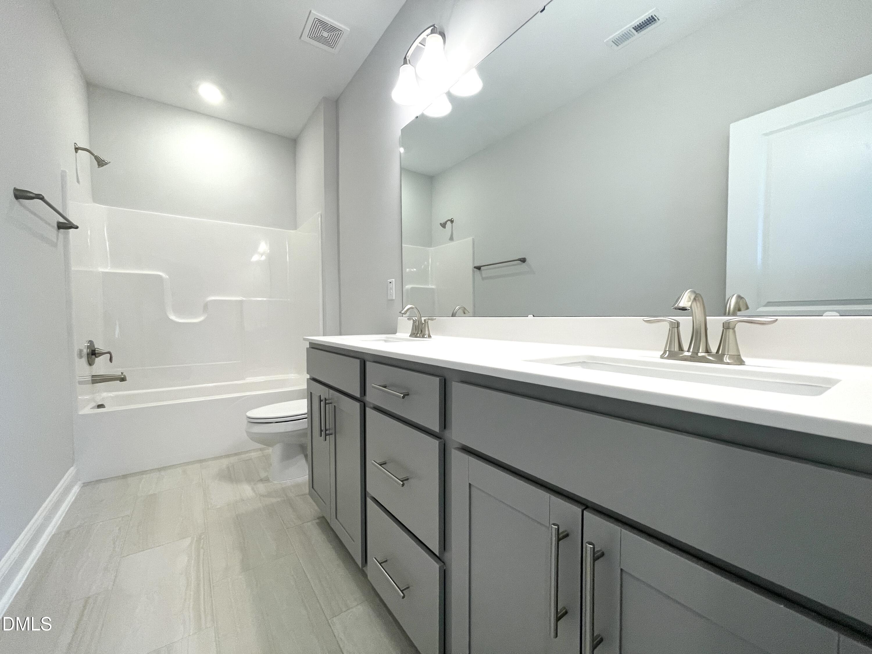 152 Baymouth Lane Raleigh, NC 27610 - Photo 26 of 34 a bathroom with a sink a toilet and shower