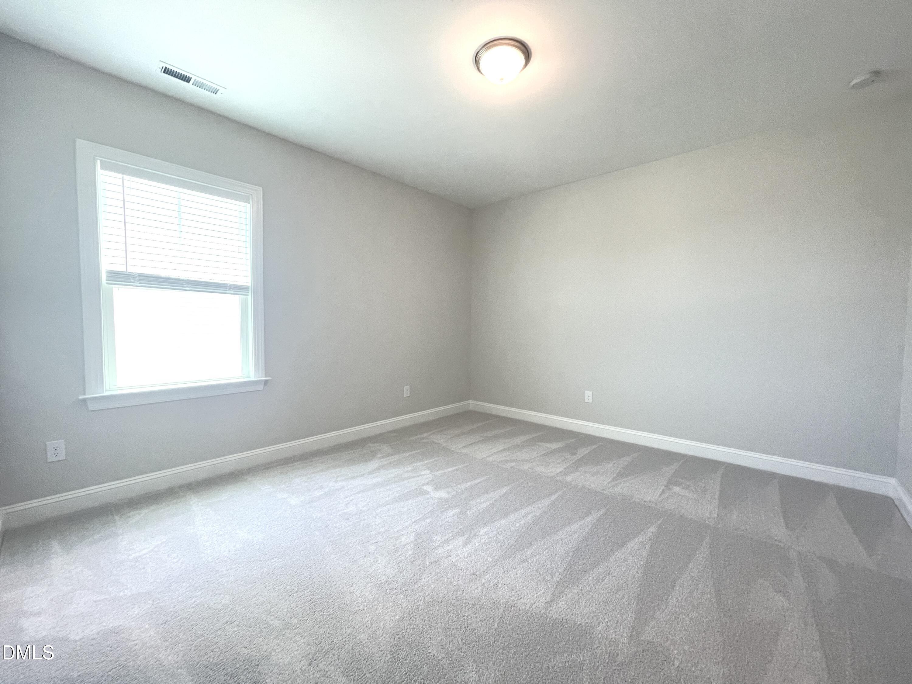 152 Baymouth Lane Raleigh, NC 27610 - Photo 27 of 34 an empty room with a window