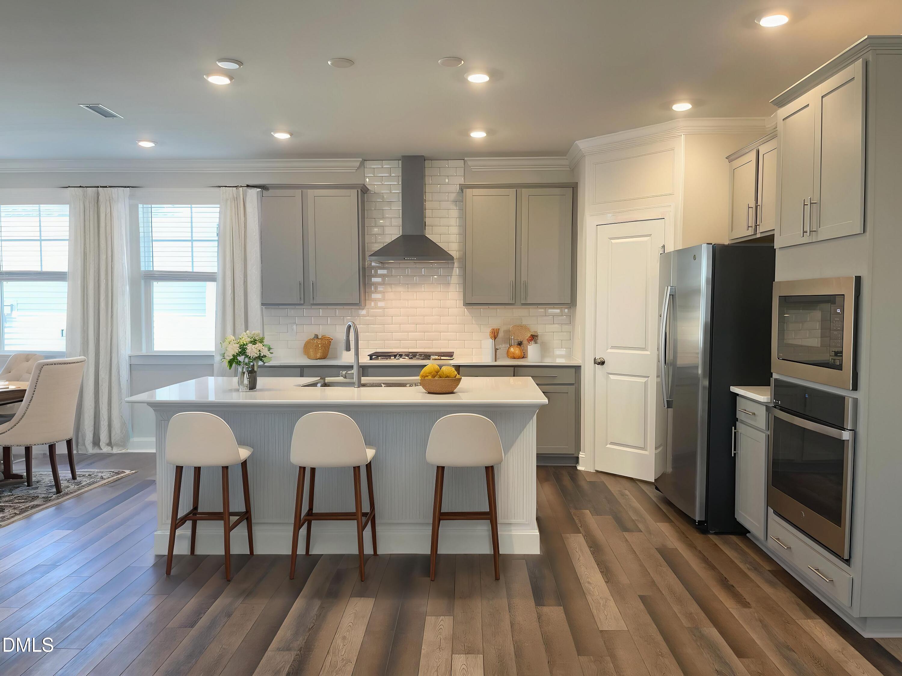 152 Baymouth Lane Raleigh, NC 27610 - Photo 10 of 34 a large kitchen with a table and chairs