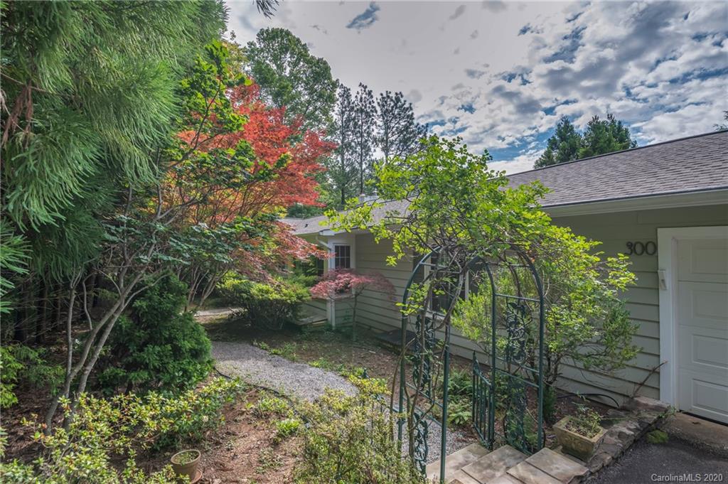 300 Doubleday Road Tryon, NC 28782 - Photo 2 of 38 a backyard of a house with lots of green space