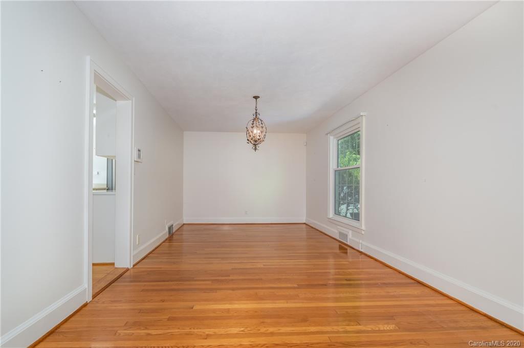 300 Doubleday Road Tryon, NC 28782 - Photo 12 of 38 a view of empty room with wooden floor and fan