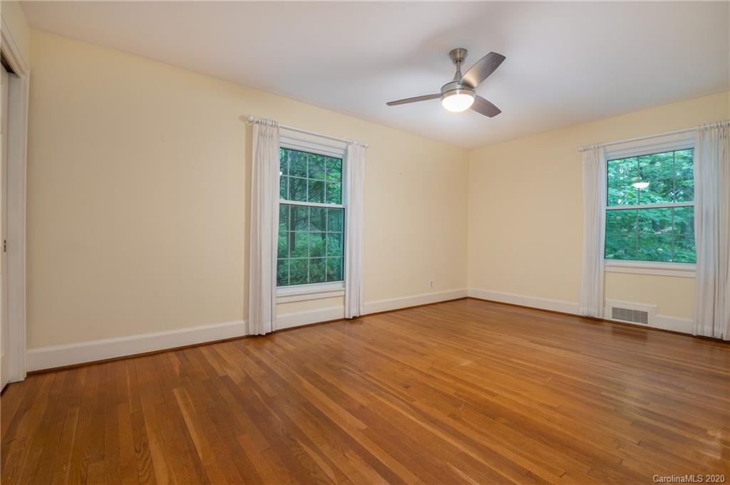 300 Doubleday Road Tryon, NC 28782 - Photo 23 of 38 a view of an empty room with wooden floor and a window