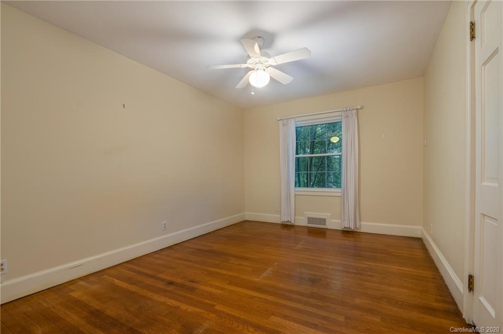 300 Doubleday Road Tryon, NC 28782 - Photo 25 of 38 a view of an empty room with wooden floor and a window